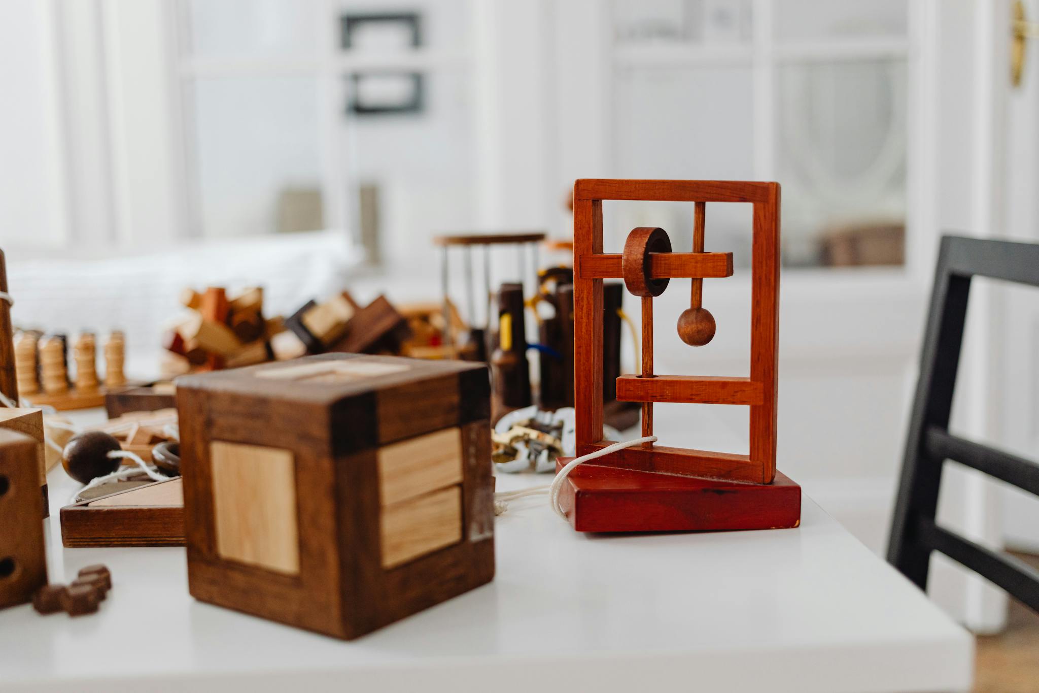 Wooden puzzles on a table showcasing a minimalist indoor setting.