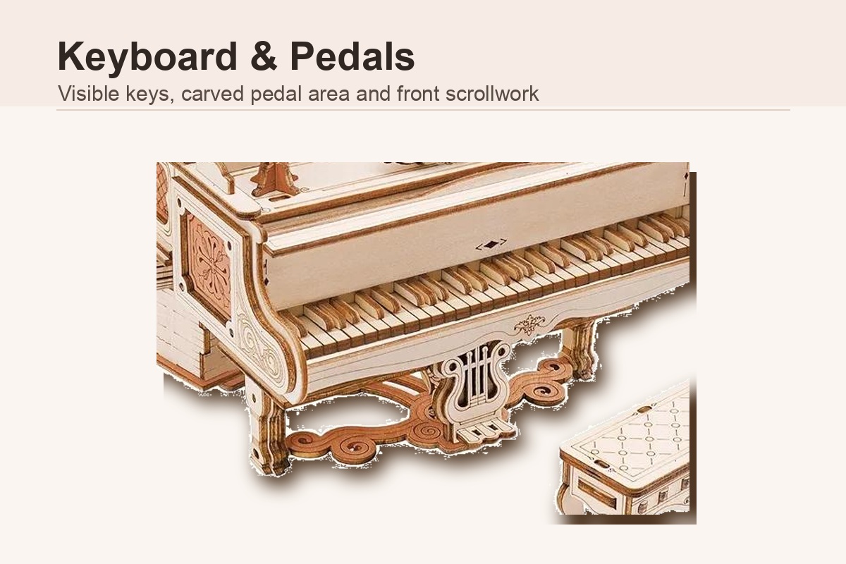 Piano model music box keyboard and carved pedal detail close-up
